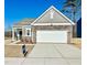 Newly constructed craftsman style home with stone and board and batten accents at 456 Glover Park Memorial Drive, Nashville, NC 27856