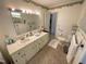 Clean bathroom with double vanity and walk in shower at 515 Docs Rd, Lillington, NC 27546
