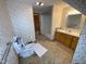 Bathroom with tub, toilet, vanity, and linen closet at 515 Docs Rd, Lillington, NC 27546