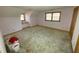 Simple bedroom with light walls, carpet, and built-in shelving at 515 Docs Rd, Lillington, NC 27546