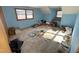 Upstairs bedroom with light blue walls and a large window at 515 Docs Rd, Lillington, NC 27546