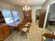 Bright dining room featuring a wooden table and chairs, and a built-in hutch at 515 Docs Rd, Lillington, NC 27546