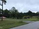 Gravel driveway leading to a home and gate at 515 Docs Rd, Lillington, NC 27546