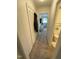 Long hallway with linen closet and carpet flooring at 515 Docs Rd, Lillington, NC 27546