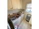 Laundry room with washer, dryer and storage shelves at 515 Docs Rd, Lillington, NC 27546