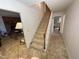 Staircase with wooden railing leading to upper level at 515 Docs Rd, Lillington, NC 27546