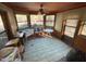 Sunroom with ample natural light and a view of the backyard at 515 Docs Rd, Lillington, NC 27546