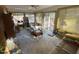 Spacious sunroom with multiple windows and access to the outdoors at 515 Docs Rd, Lillington, NC 27546
