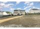 Expansive backyard with a view of the home's exterior and neighboring properties at 575 Crystal Spring Dr, Sanford, NC 27332