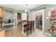 Bright dining area with a sliding glass door, adjacent to a cozy kitchen and laundry room at 575 Crystal Spring Dr, Sanford, NC 27332