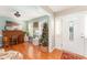Inviting foyer with wood floors, natural light, and festive holiday decor create a warm and welcoming entry at 575 Crystal Spring Dr, Sanford, NC 27332