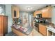 Kitchen with stainless steel appliances, plenty of cabinet space, and view to dining area at 575 Crystal Spring Dr, Sanford, NC 27332