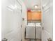 Functional laundry room equipped with a washer, dryer, and cabinet storage at 575 Crystal Spring Dr, Sanford, NC 27332