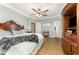 Spacious main bedroom with wood floors, tray ceiling, and decorative furnishings at 575 Crystal Spring Dr, Sanford, NC 27332
