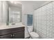 Clean bathroom with dark vanity and geometric shower curtain at 5940 Illuminate Ave, Raleigh, NC 27616