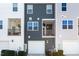 Exterior view of townhouses with garages at 5940 Illuminate Ave, Raleigh, NC 27616