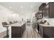 Modern kitchen with an island and stainless steel appliances at 5940 Illuminate Ave, Raleigh, NC 27616