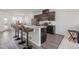 Modern kitchen with granite counters and dark brown cabinets at 5940 Illuminate Ave, Raleigh, NC 27616