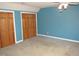 Spacious bedroom with double door closet and ceiling fan at 706 N Crescent Dr, Creedmoor, NC 27522