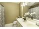 Bathroom with double sinks, large mirror, and shower/tub combination at 805 Joshua Clay Dr, Rocky Mount, NC 27803