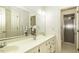 Bathroom features double sinks, framed mirror, neutral wallpaper and glass enclosed shower at 805 Joshua Clay Dr, Rocky Mount, NC 27803