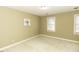 Bedroom features natural light, neutral paint, carpet flooring, and closet space at 805 Joshua Clay Dr, Rocky Mount, NC 27803