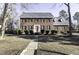 Brick two-story house with a red door and landscaped lawn at 805 Joshua Clay Dr, Rocky Mount, NC 27803