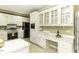 White kitchen cabinets, stainless steel appliances, and a built-in desk area at 805 Joshua Clay Dr, Rocky Mount, NC 27803