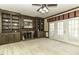 Charming library with built-in shelving, fireplace, and French doors at 805 Joshua Clay Dr, Rocky Mount, NC 27803