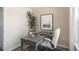 Bright home office features a large window, gray desk, and comfortable chair at 8636 Brixton Shay Dr, Raleigh, NC 27616