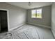 Bedroom with a window and closet, offering comfort and functionality at 90 Firefly Ln, Louisburg, NC 27549