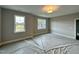 Spacious bedroom with two large windows offering abundant natural light at 90 Firefly Ln, Louisburg, NC 27549