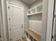 Mudroom area featuring custom wall bench, and wooden bench with storage at 90 Firefly Ln, Louisburg, NC 27549