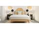 Cozy bedroom featuring a full bed, nightstands, and unique wall decor at 904 Thimbleweed Way, Wake Forest, NC 27587