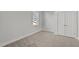 Simple bedroom with window, closet, and carpeted floors at 1004 Lacala Ct, Wake Forest, NC 27587