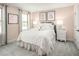 Charming bedroom with a white bed, and soft pink accents at 1008 Country Pasture Cv, Wendell, NC 27591