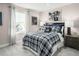 Blue and white plaid bedding in a cozy bedroom setting at 1008 Country Pasture Cv, Wendell, NC 27591
