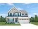 Two-story house with gray siding, white trim, and a two-car garage at 1008 Country Pasture Cv, Wendell, NC 27591