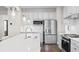 Modern kitchen with white cabinets, stainless steel appliances and breakfast bar at 1020 Country Pasture Cv, Wendell, NC 27591