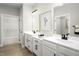 Bright bathroom featuring dual vanities, modern fixtures, and a separate room for the toilet at 1024 Country Pasture Cv, Wendell, NC 27591