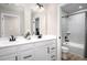 Bathroom featuring double sinks, a white vanity and a tile shower/tub combo at 1024 Country Pasture Cv, Wendell, NC 27591