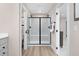 Modern bathroom boasts a large glass enclosed shower, wood look flooring, and light colored walls at 1024 Country Pasture Cv, Wendell, NC 27591