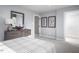 Spacious bedroom with a dresser, a large mirror and framed art at 1024 Country Pasture Cv, Wendell, NC 27591