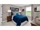 Nicely decorated bedroom features a dark wood headboard and bright blue comforter at 1024 Country Pasture Cv, Wendell, NC 27591