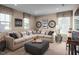 Cozy bonus room with a sectional sofa and bicycle themed decor at 1024 Country Pasture Cv, Wendell, NC 27591
