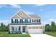 Two-story house with gray siding, white trim, and a two-car garage at 1024 Country Pasture Cv, Wendell, NC 27591