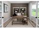 Stylish home office featuring a wooden desk, built-in bookshelves, and natural light at 1024 Country Pasture Cv, Wendell, NC 27591