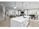 Bright kitchen view showcasing a large island with seating, stainless steel appliances, and open floor plan at 1024 Country Pasture Cv, Wendell, NC 27591