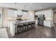 Island kitchen with granite countertops and white cabinets at 1024 Country Pasture Cv, Wendell, NC 27591