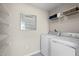 Well organized laundry room with modern washer and dryer, wire shelving and decor at 1024 Country Pasture Cv, Wendell, NC 27591